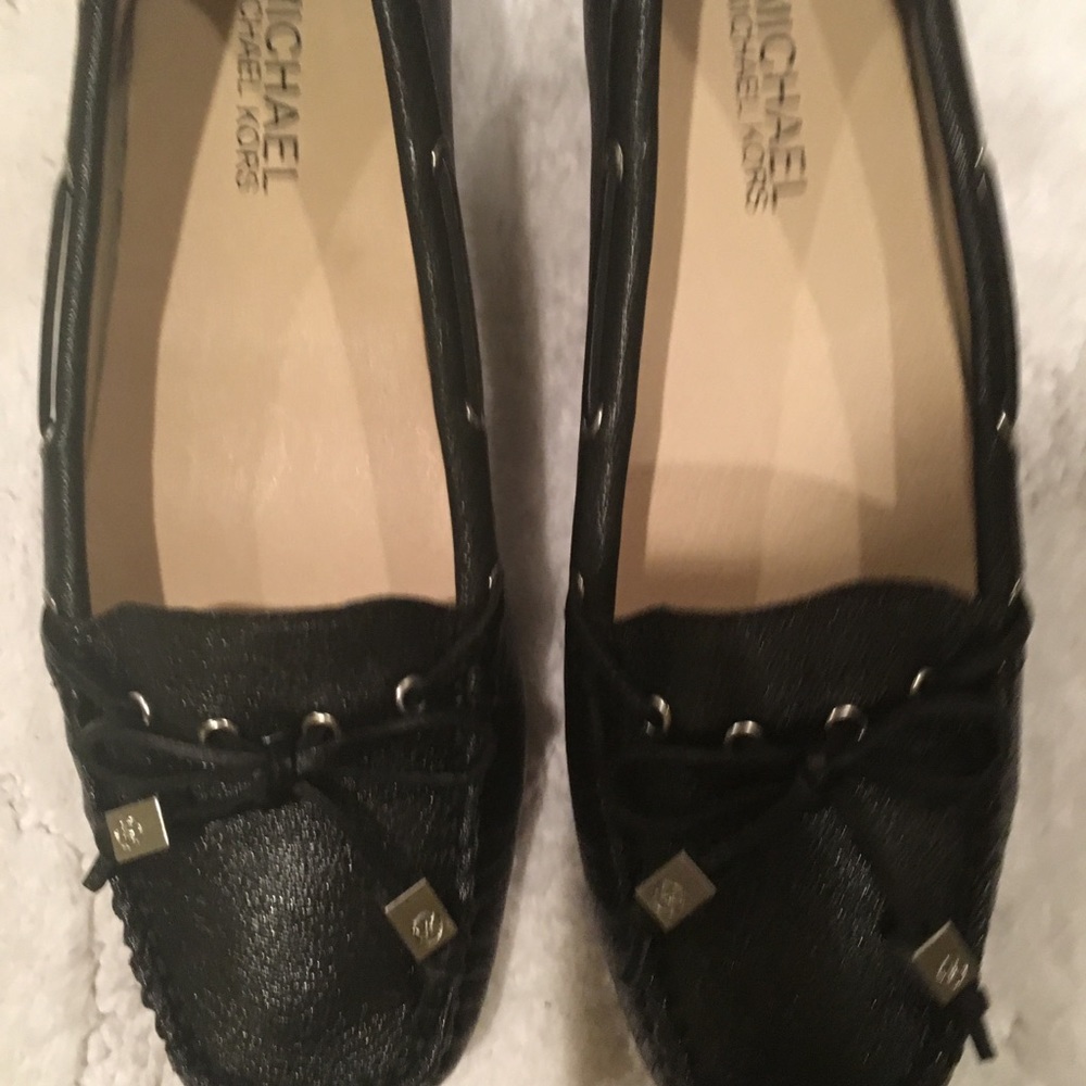 MICHAEL KORS black loafer pebbled leather with silver accents.